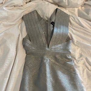 Long evening dress. Silver sparkles. Size 6. Never worn.  Bandage style dress